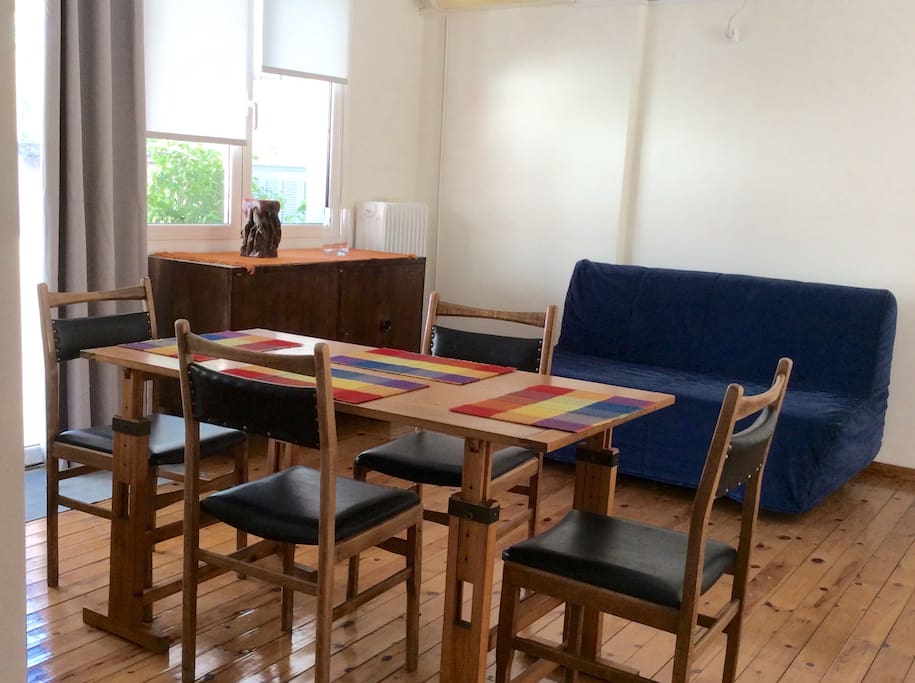 The dining table and the sofa bed.