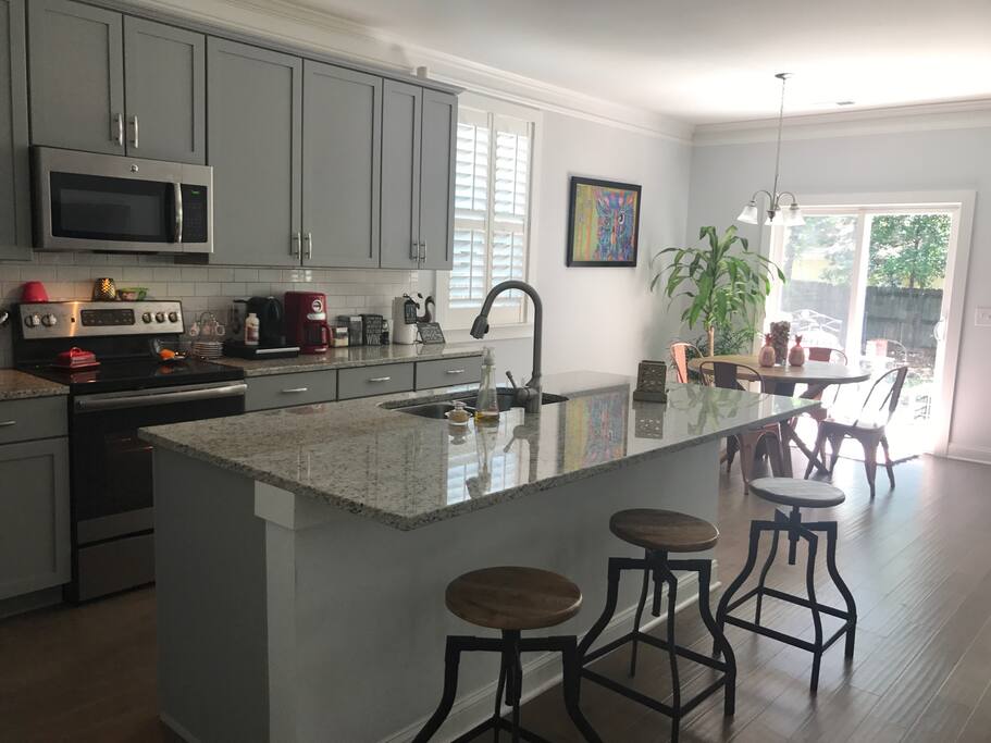 Kitchen with 3 stools and breakfast nook!! Kitchen has American coffee maker and Nespresso machine for those that need their morning cup of Joe!