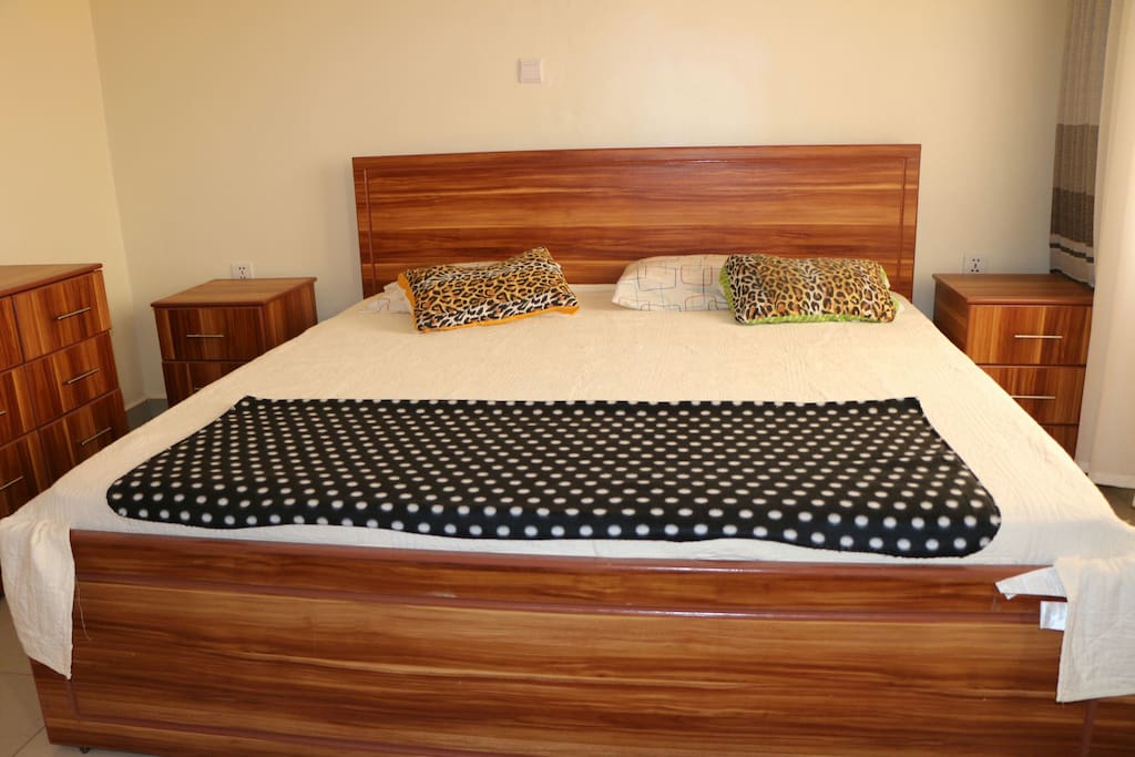 The main room has a big bed 2x2, it is connected to the balcony with a great view to Kagarama hill.