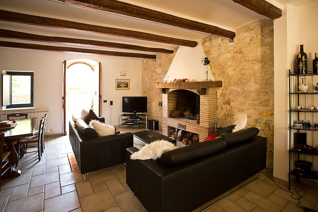 Living room diner with open fire place.