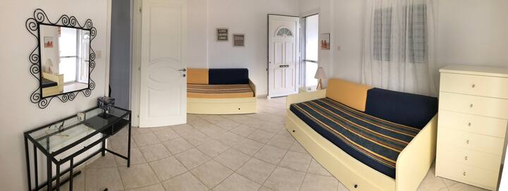 upstairs bedroom (back garden view) with two single beds that expand if needed, a large veranda and a balcony