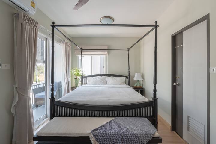 Bright and Breezy master bedroom with good sized balcony and outdoor sitting area.