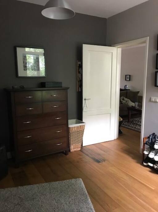 View from the bed - large and spacious bedroom with a small "nook" to place luggage