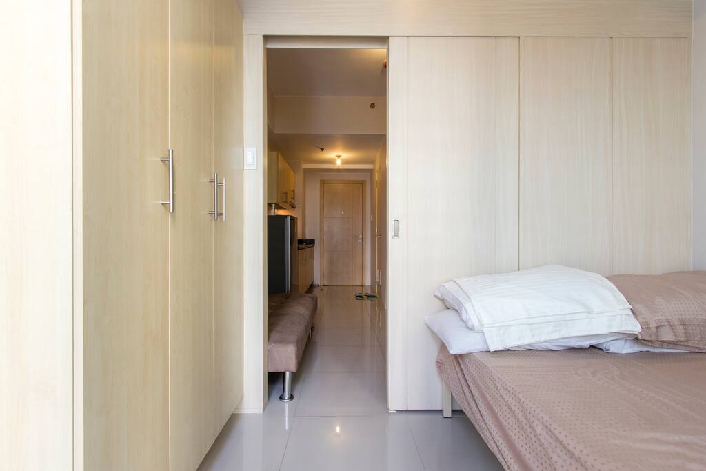 View from bedroom to dining room and kitchen