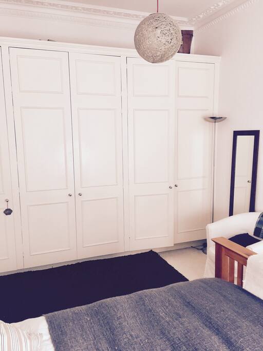 Bedroom with fully fitted wardrobes.