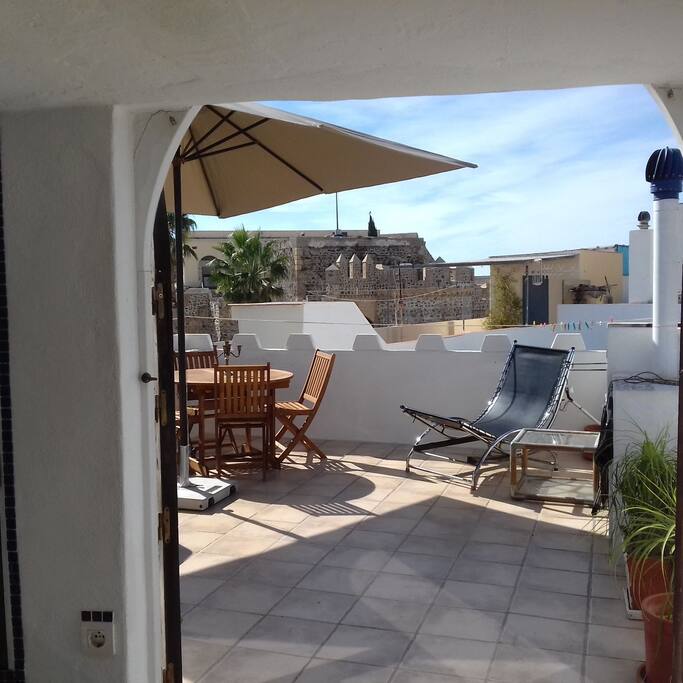 View from the sun room out onto the terrace. Enjoy a barbeque and a drink whilst taking in the view of the castle.