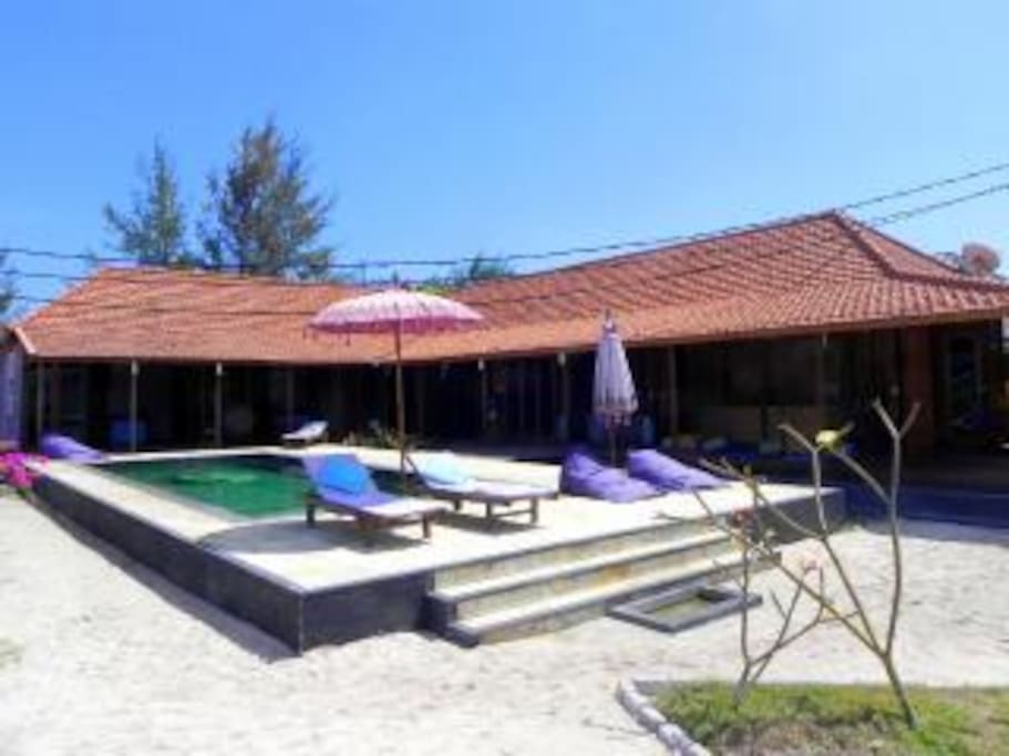 Room looks out to pool and beach
