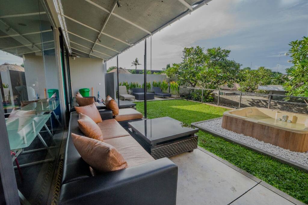 Enough room to enjoy lounging on the grass or a comfy sofa, taking a dip in the refreshing hot tub, or relaxing in a lounge chair!