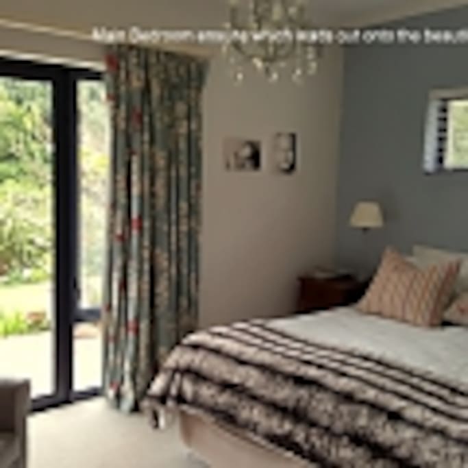 Main bedroom, king bed, doors opening out to garden
