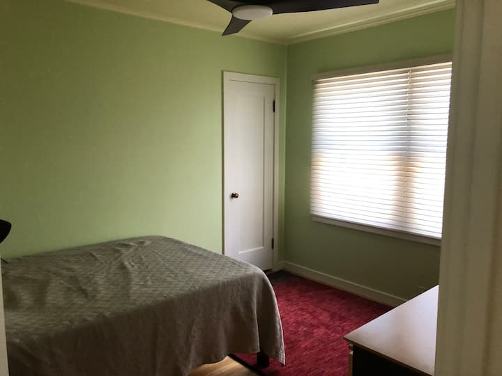 The green bedroom with new memory foam full mattress bed.