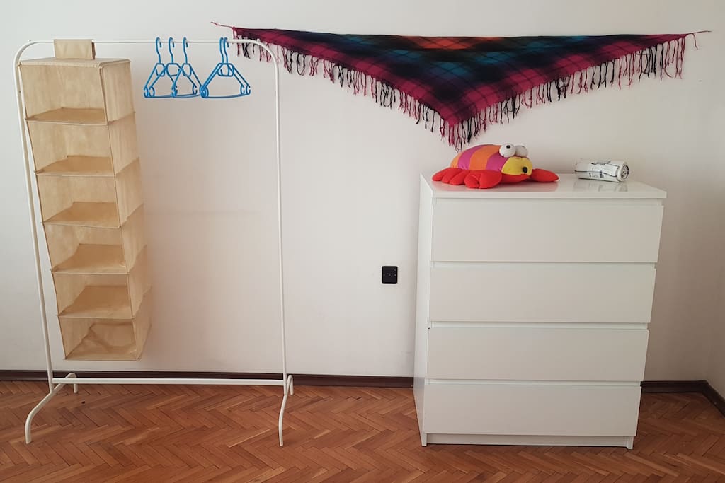 You get a large dresser and a minimalist rack to hang your clothes on.