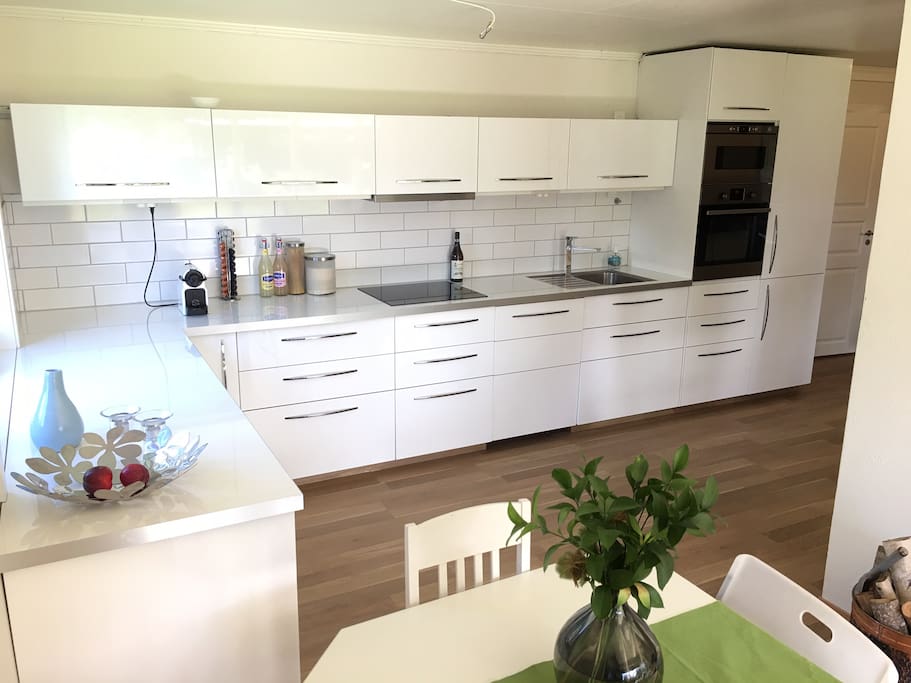 Kitchen with cooking top, stove, dish washer and micro wave.