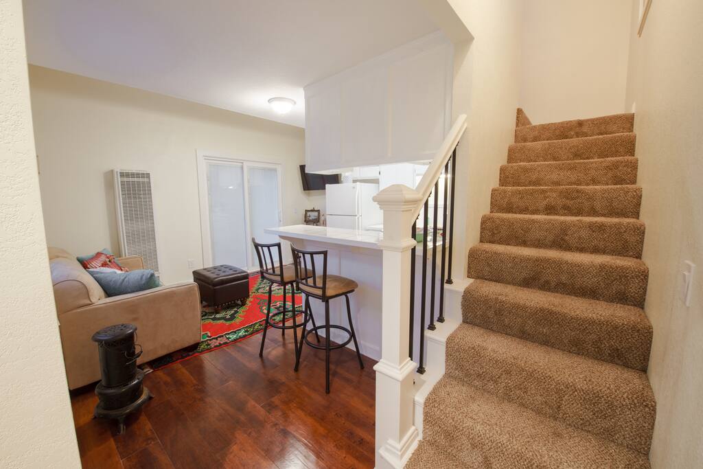 Living Room with Stairs to Studio Loft