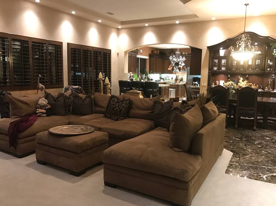 Living room with sofa that seats 8, big screen tv