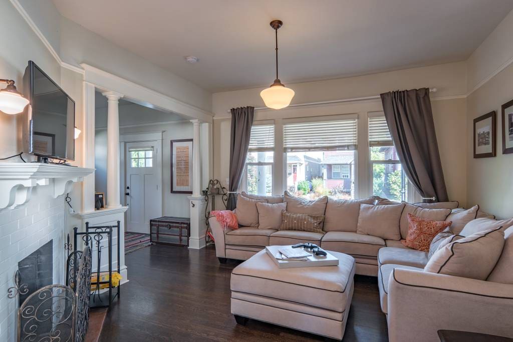 Living room with sectional and large front window