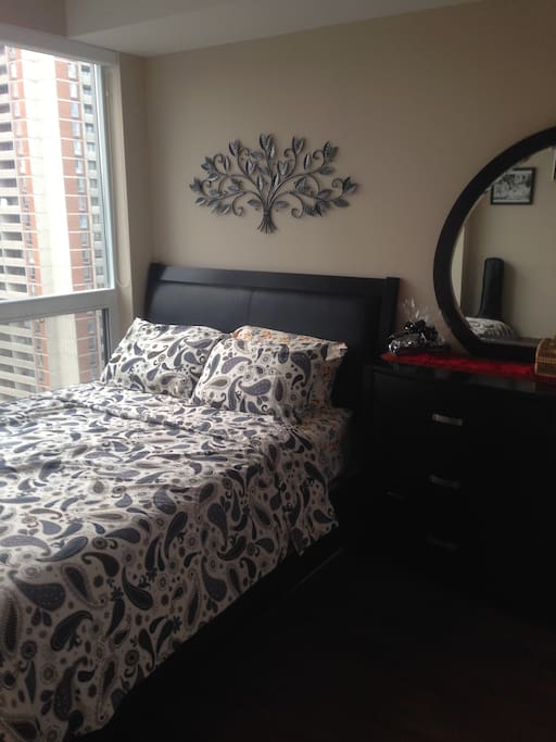 Bedroom - Queen size comfortable bed, with a full dresser table on the side