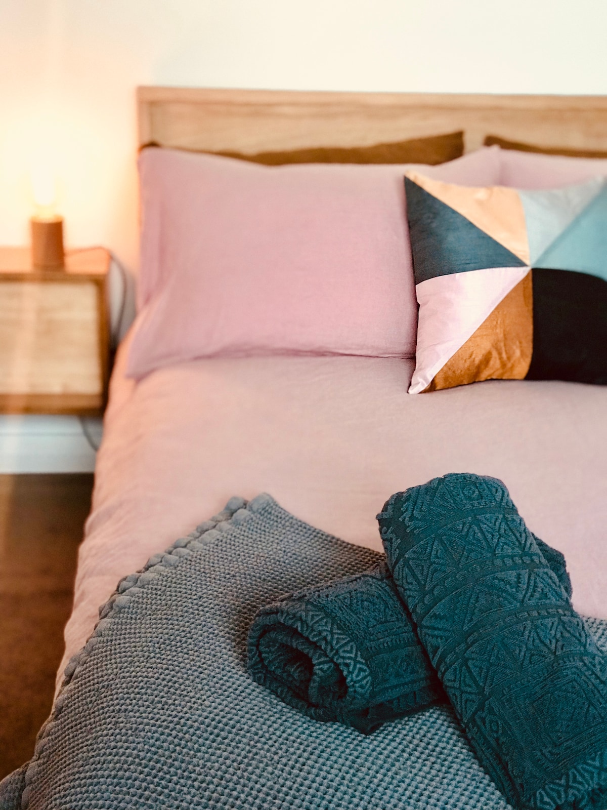 double bed with luxurious linen and towels