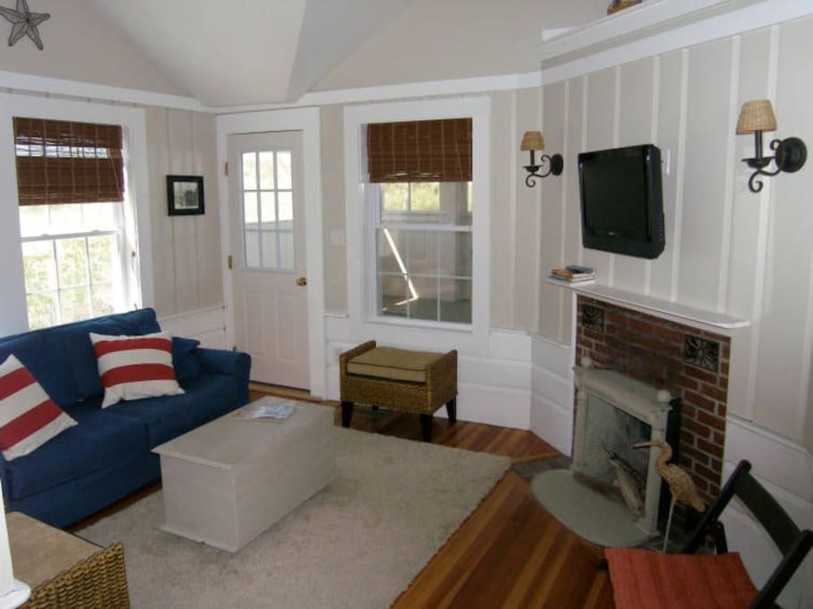 Updated living room that leads to screen porch
