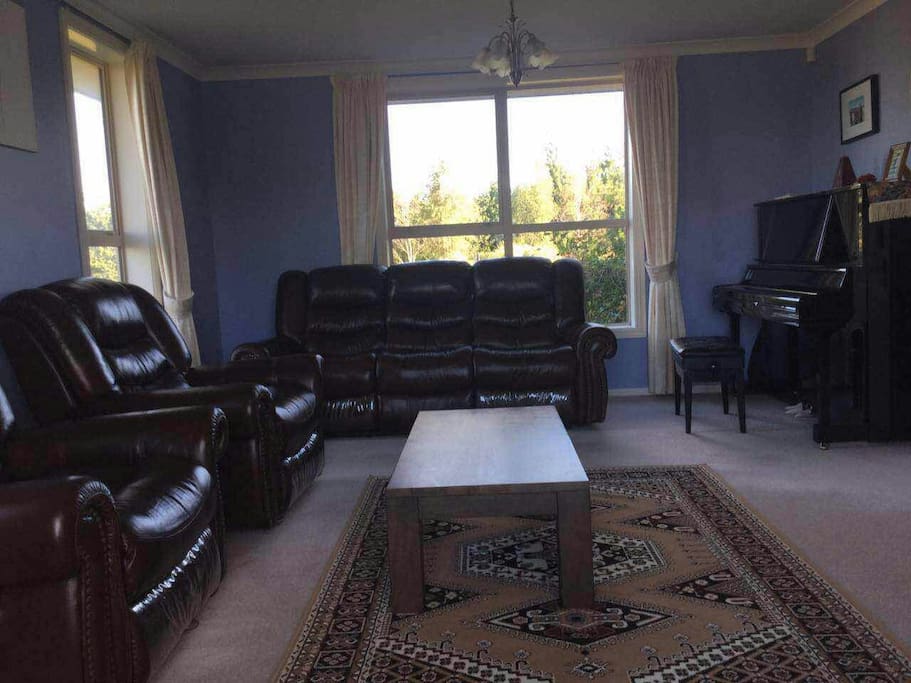 This is the secondary living room, with a U5 upright piano for your entertainment.