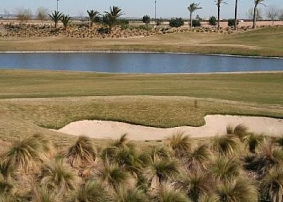 View of the golf course from the dual aspect balcony.