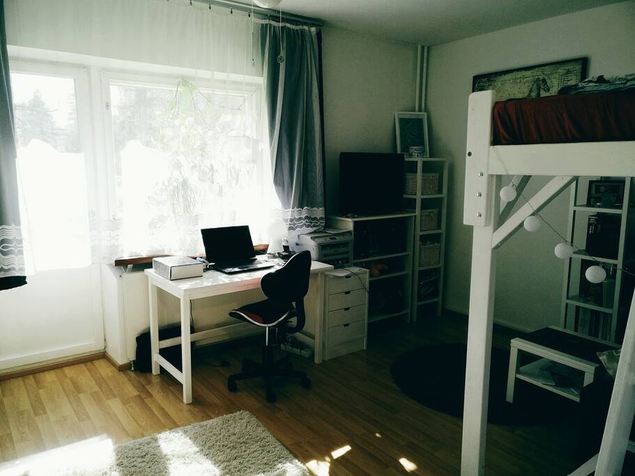 One room has a lot of light from big windows. There are blackout curtains so you can sleep in dark.