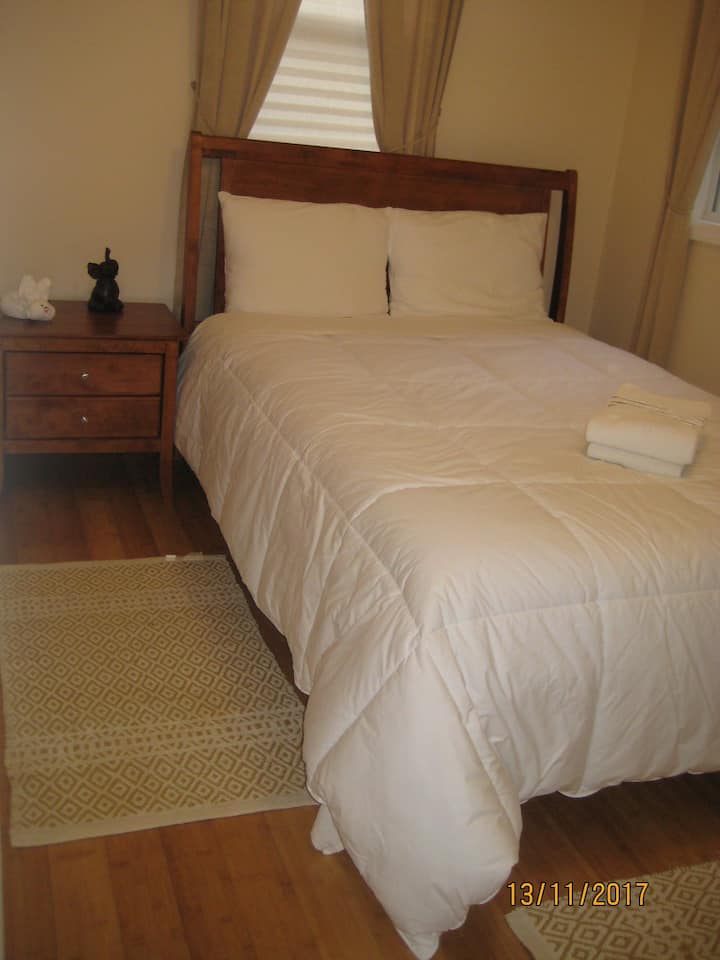 The bedroom is newly renovated with bamboo flooring.