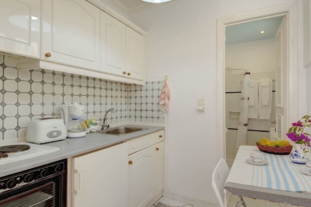 Kitchen room with bathroom in far view