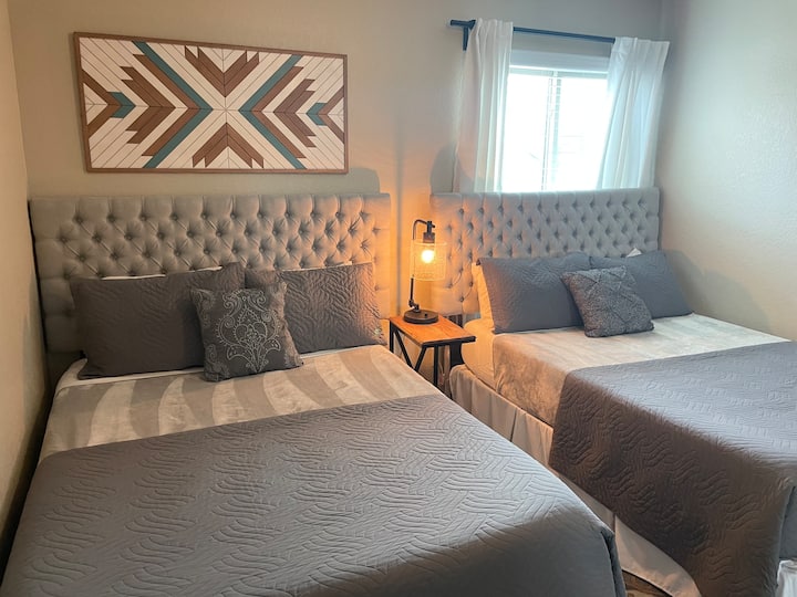 2 Full memory foam beds with plush bedding.