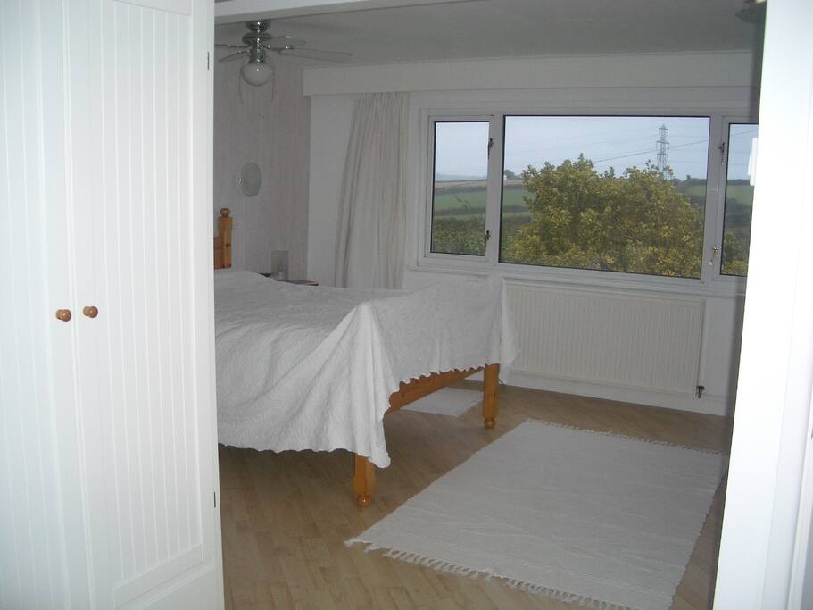 Double aspect L-shaped master suite, with ensuite bathroom, and views to River Tamar, Dartmoor, Bodmin Moor . .