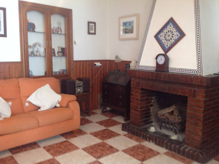 Living room, with open log fire.