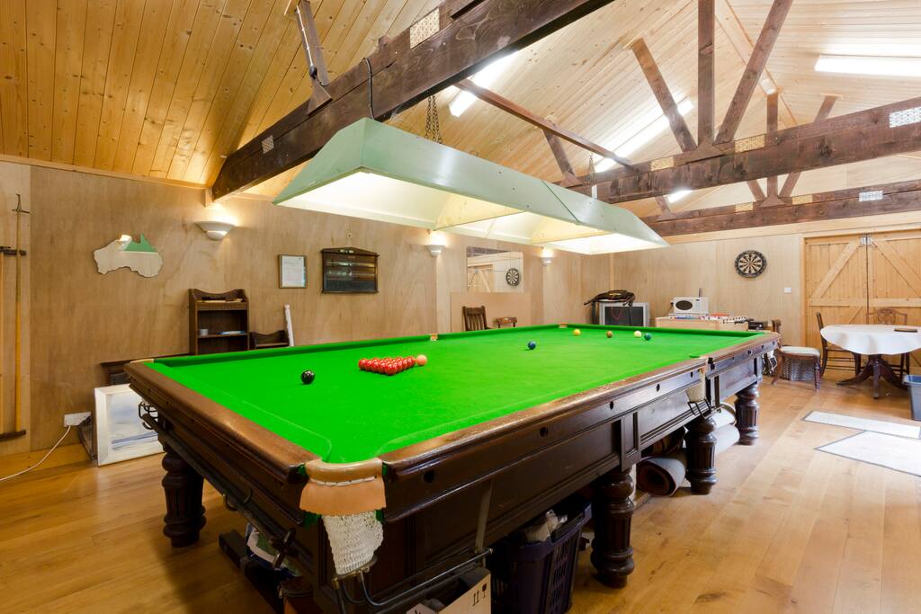 100 year old snooker table. Dartboard, table football.