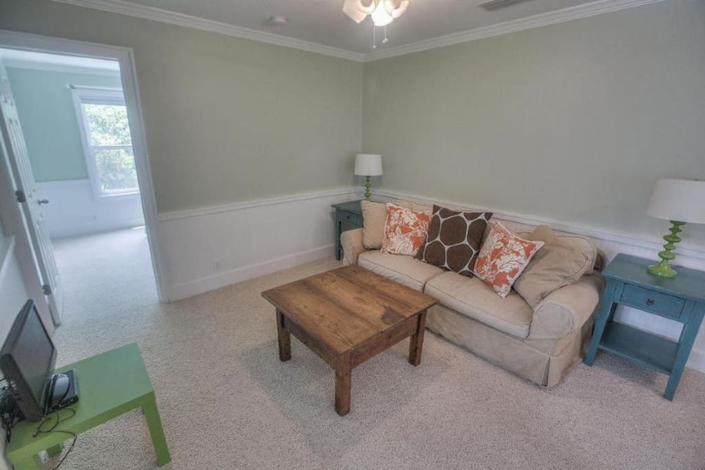 Sleeper sofa in living area and queen bed in bedroom.