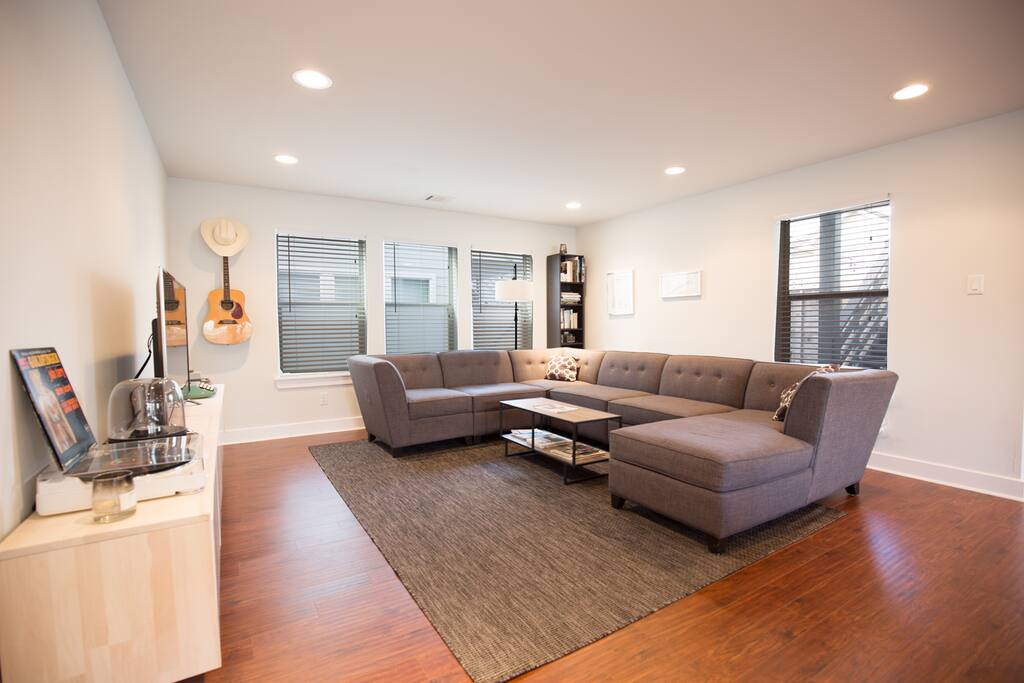 Large couch, smart TV with cable, Netflix, etc., record player, bluetooth stereo..