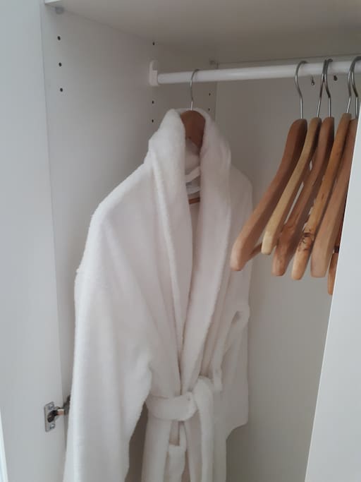 Wardrobe to store your clothes and a fluffy robe to wrap yourself in.