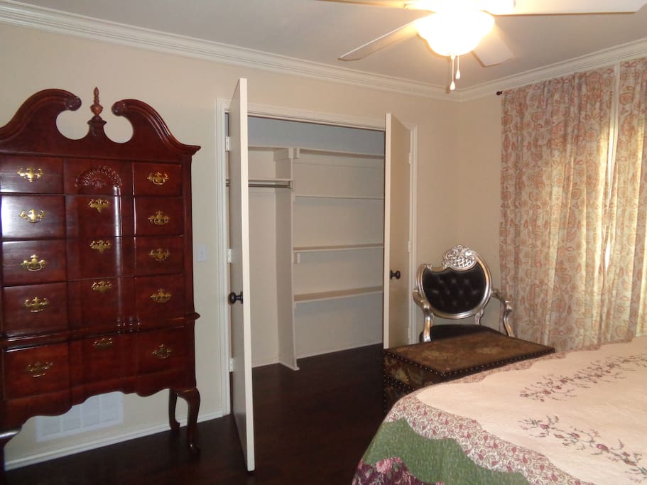 Private bedroom, with chest and large closet.