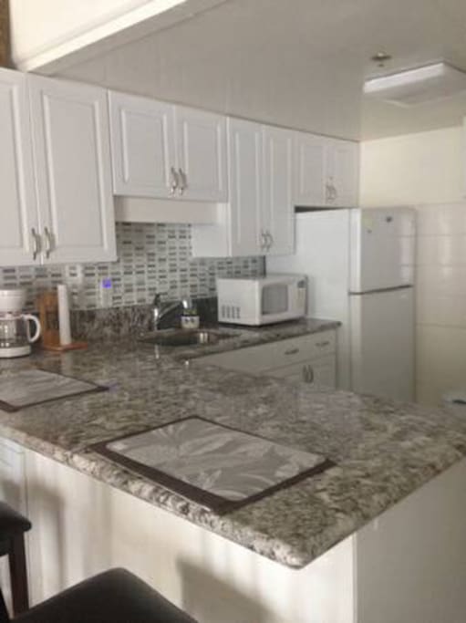 Fully stocked kitchen with granite countertop and new appliances