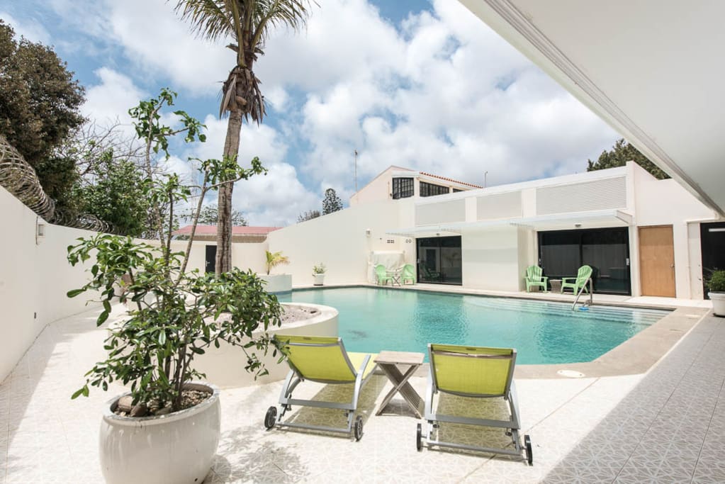 Relaxing at the pool and feel the warm sun on your skin while laying on a nice sunbed.
