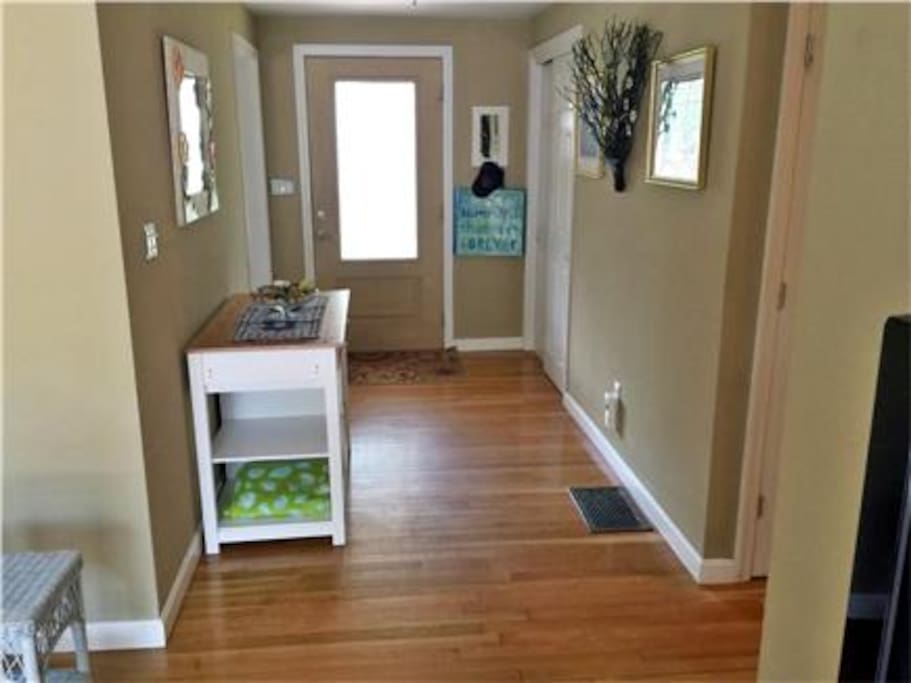 Entryway. Home feature hardwood throughout.