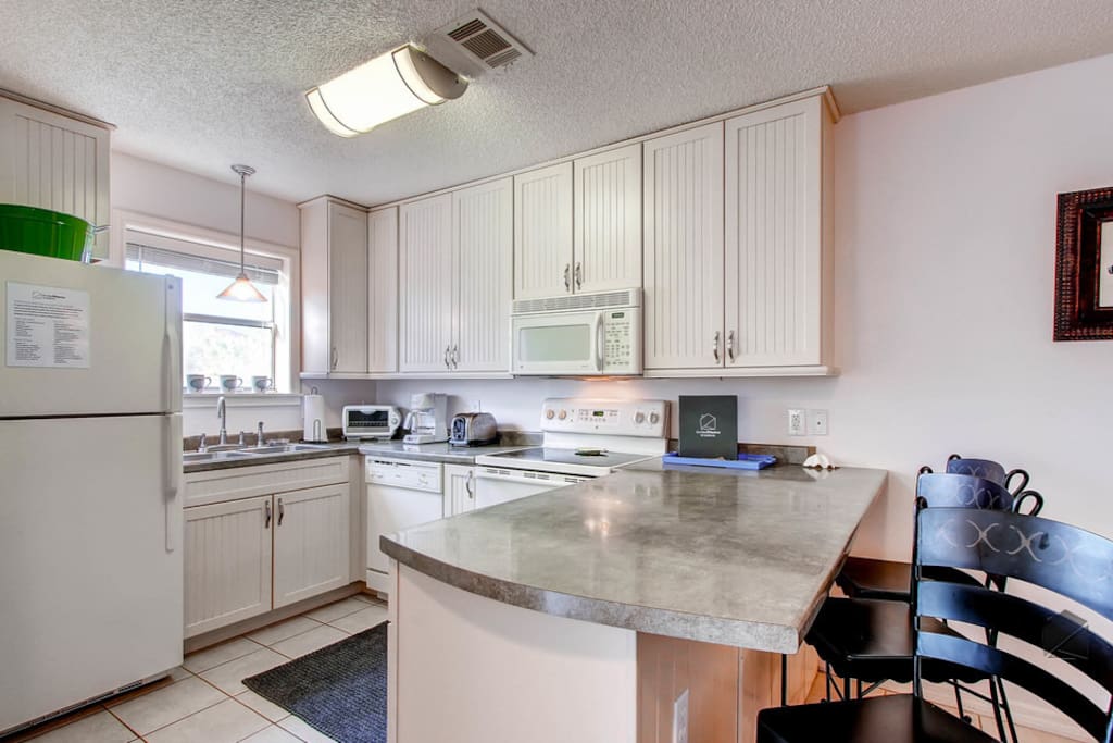 The breakfast bar, which seats 3, is the perfect spot to sip on your morning coffee.