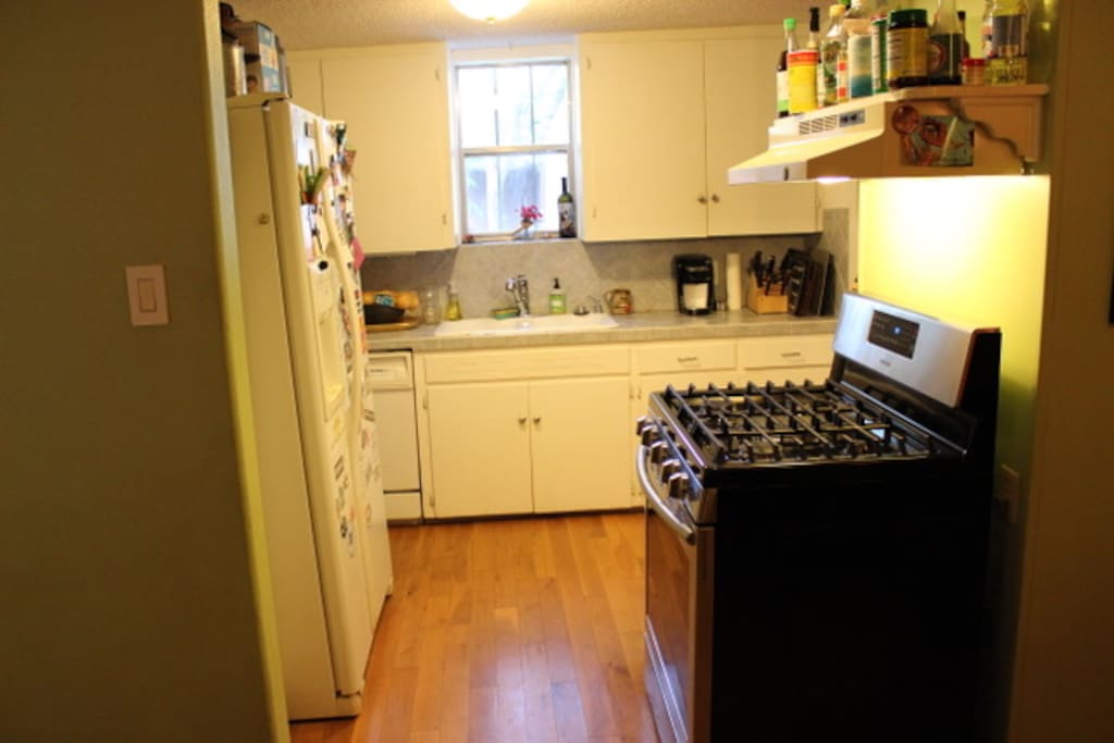Kitchen has microwave, refrigerator, and a new stove and range!