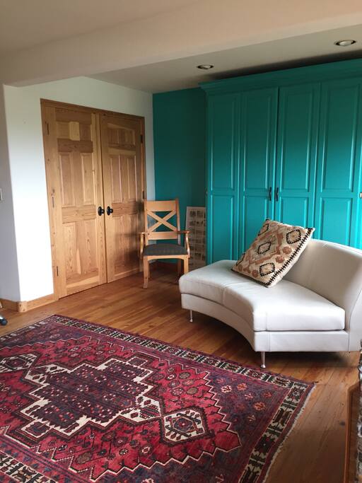 Murphy bed behind colorful cabinets