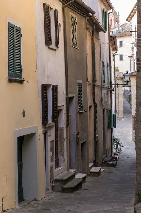 The little street with the house (white) on the left.