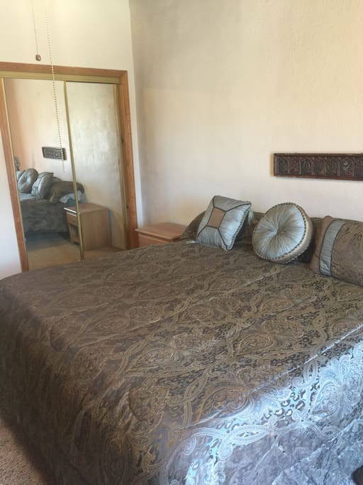 King size bed with closet and chest of drawers