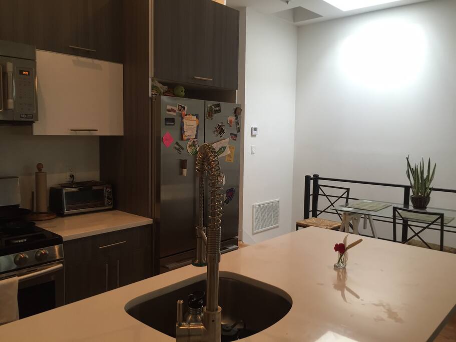 Brand new kitchen fit with stainless steel amenities, a dishwasher, microwave, toaster oven, french press & coffee grinder and all other kitchen necessities.