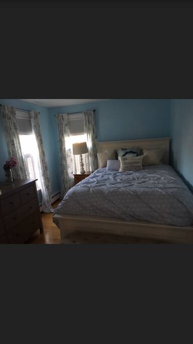 Bedroom with large dresser and closet