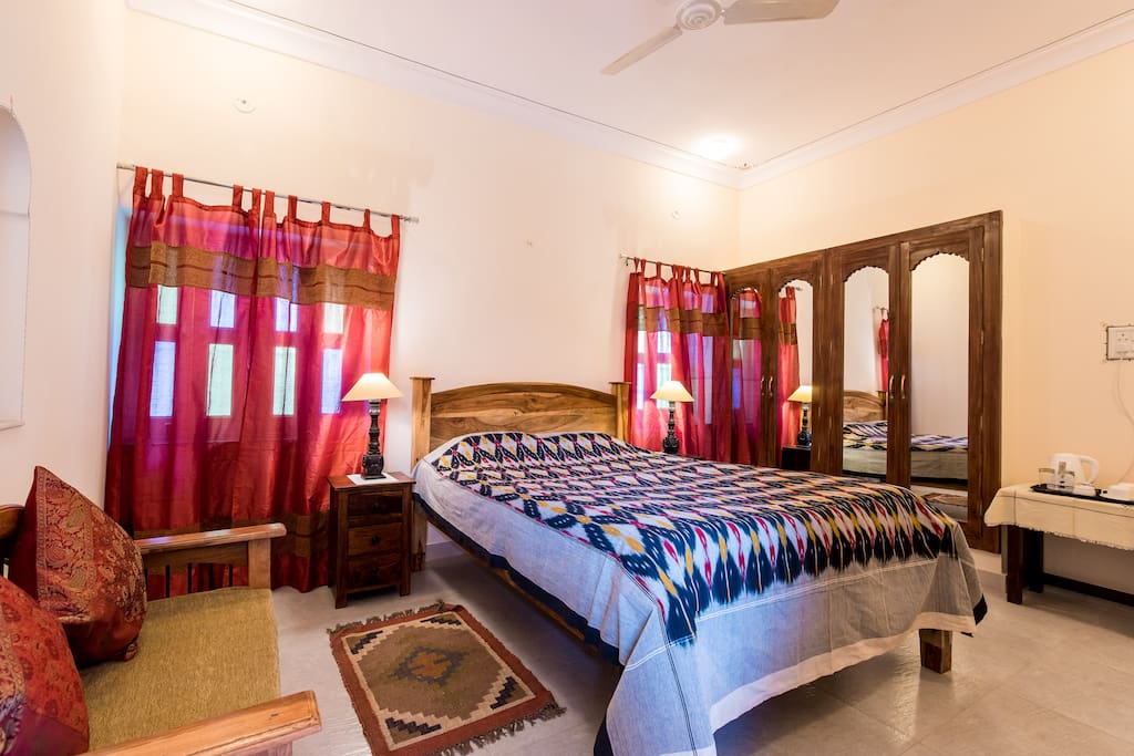 Side view of Bed, Built in Wardrobe and a sitting Couch - Room No. 3