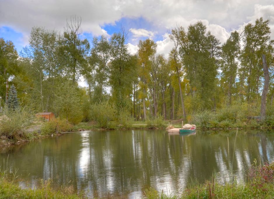 Canoe pond next to home at Durango Colorado waterfront vacation rental cabin river pond fly fishing canoe