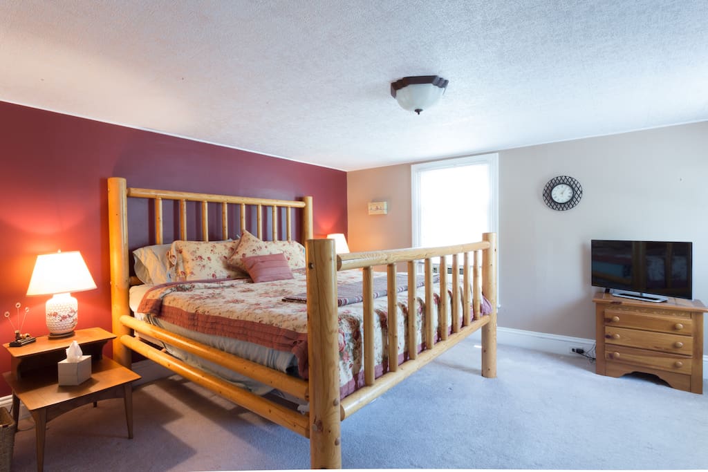 Master bedroom upstairs with king size bed