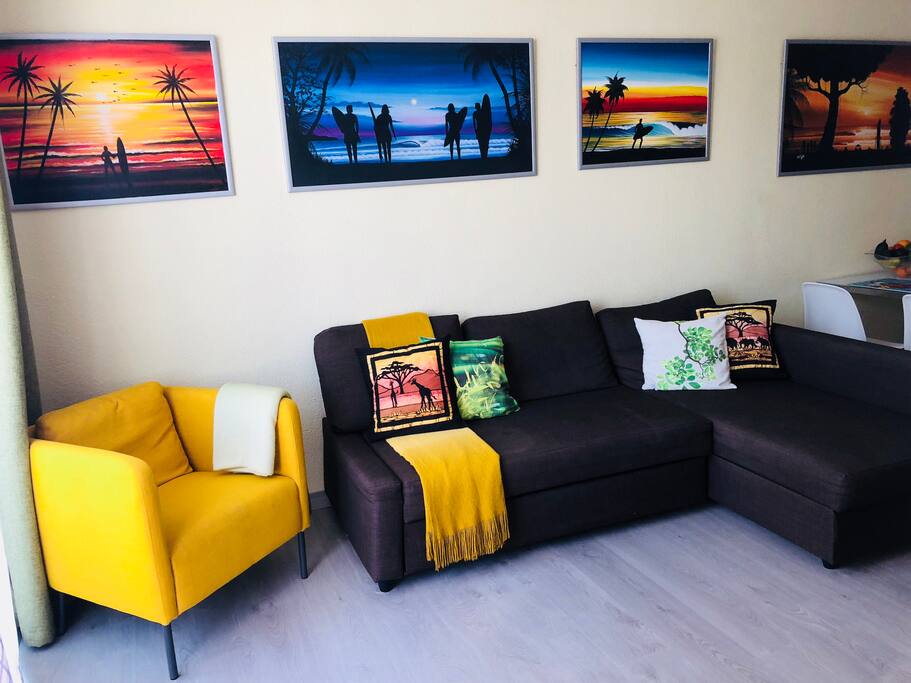 Spacious bright living room with sofa bed