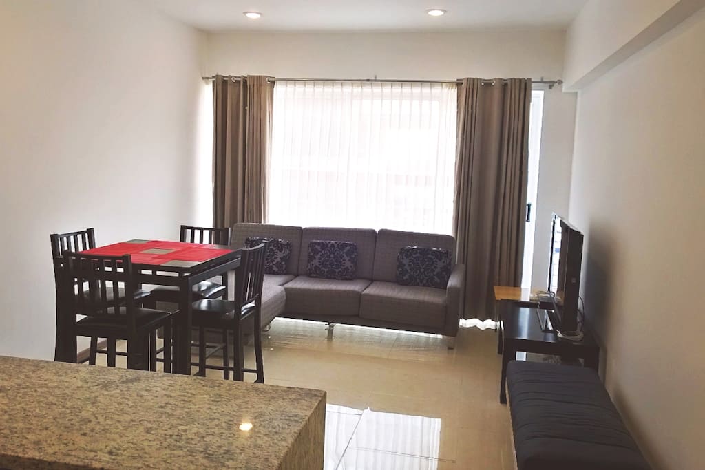 Tall chairs dinning table on livingroom with TV